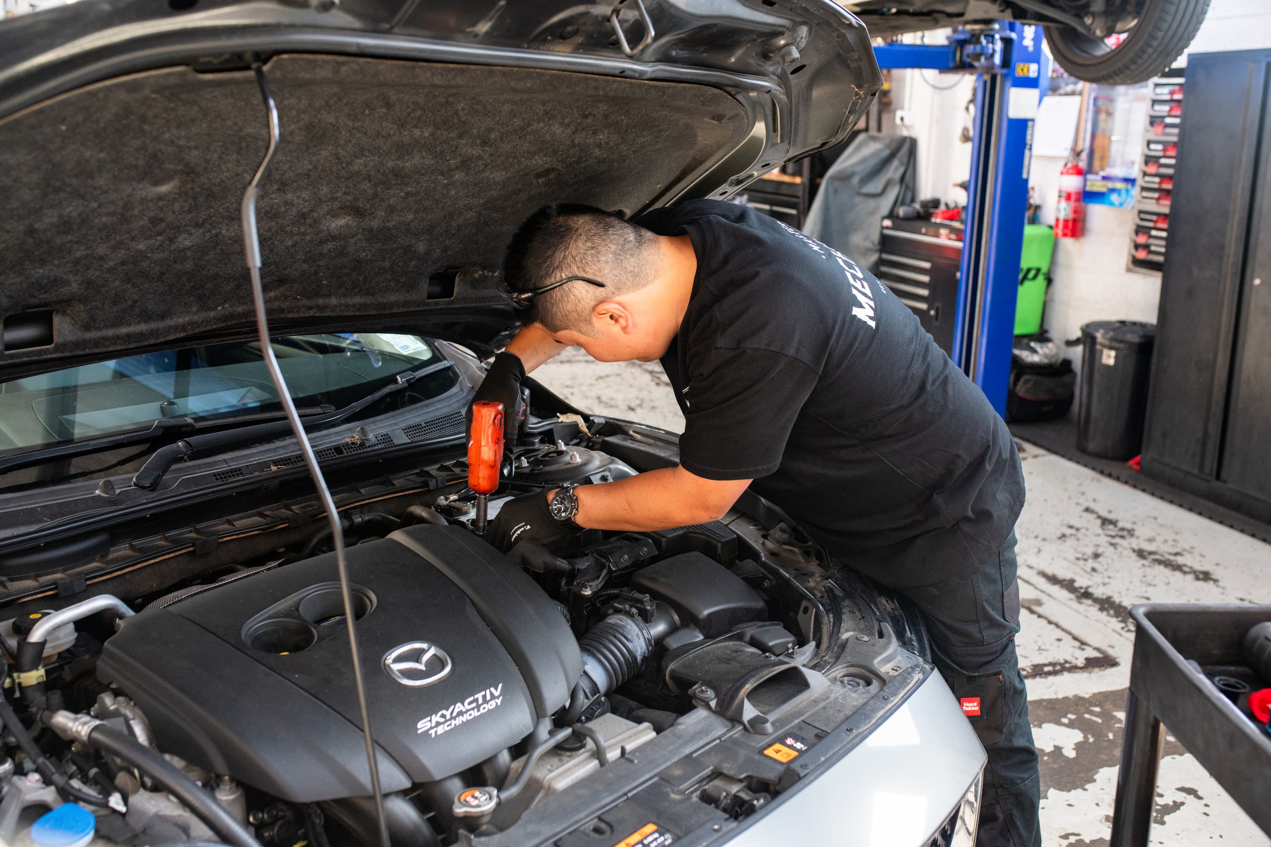 Mechanic working on a vehicle in the Master Mechanics workshop